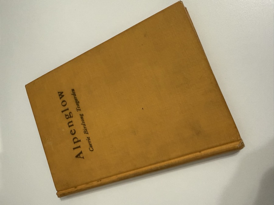A cloth-bound copy of the book Alpenglow by Corrie Birdsong Teagarden