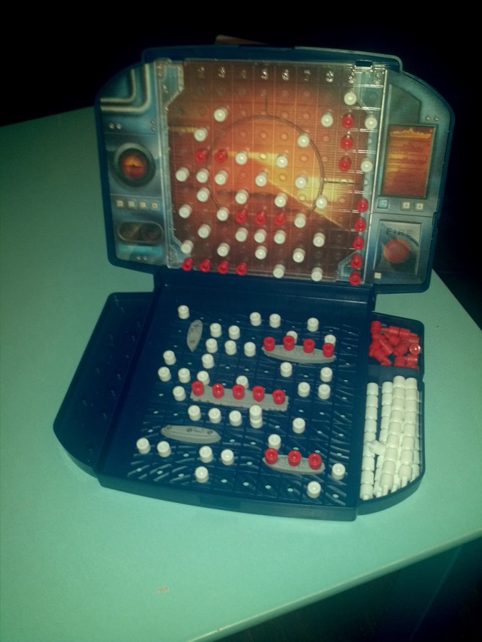 A game of Battleship laid out mid-play